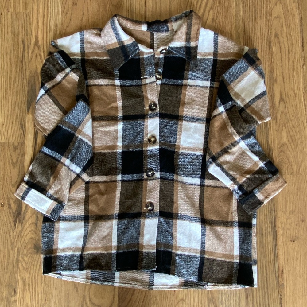 Black and brown flannel. Size Medium. From Amazon